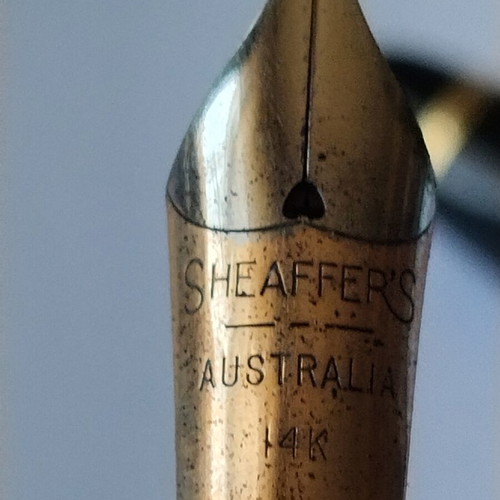 Sheaffer's vintage fountain pen set with 14K gold nibs and desk base, used