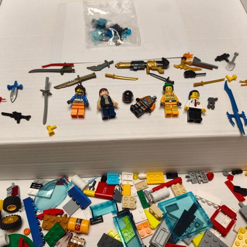 Lego lot like new with figures, weapons, and bricks