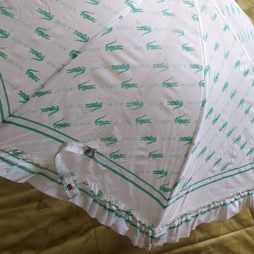 Lacoste vintage umbrella used with collectible Minnie Mouse