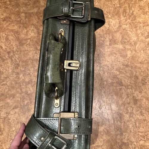 Vintage leather suitcase in dark green