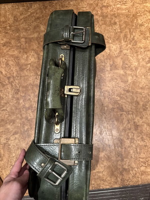 Vintage leather suitcase in dark green