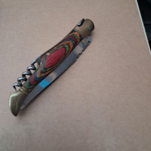 Vintage folding knife like new with multicolored wood handle