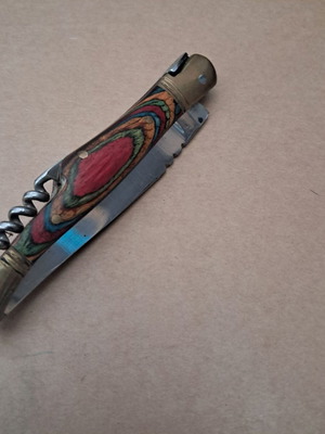 Vintage folding knife like new with multicolored wood handle