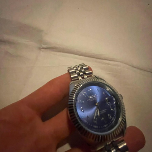 Seiko watch with blue dial and silver bracelet