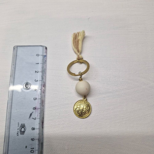 Keychain with Konstantinato like new, white and gold color