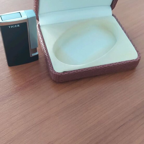Windproof lighter new in leather-type case, unused