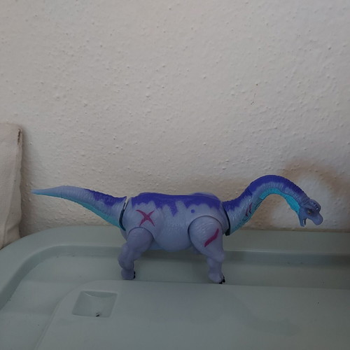 Dinosaur toy like new, purple with movable head and tail
