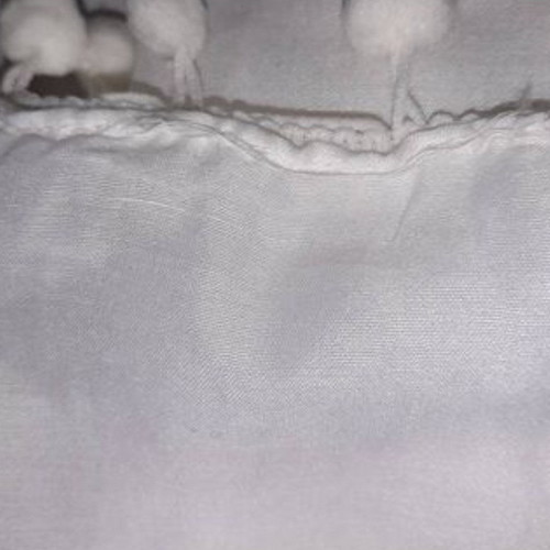Scarf with pom poms