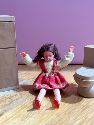 Vintage doll used with wooden fridge and toilet bowl