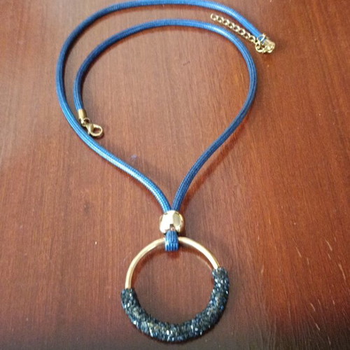 Necklace with blue cord like new with unique pendant