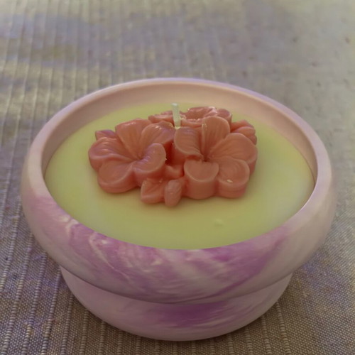Handmade candle in plaster jar with flower new