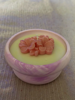 Handmade candle in plaster jar with flower new