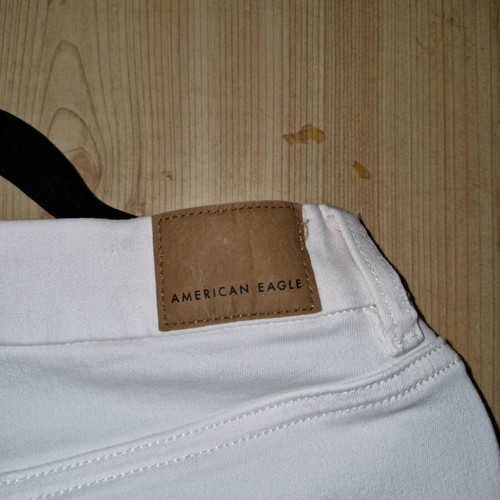American Eagle white jeans like new, size L with asymmetric hem