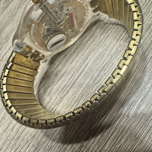 Swatch Dazzling Light χρυσαφί μπρασελέ από ανοξείδωτο ατσάλι μεταχειρισμένο σε καλή κατάσταση