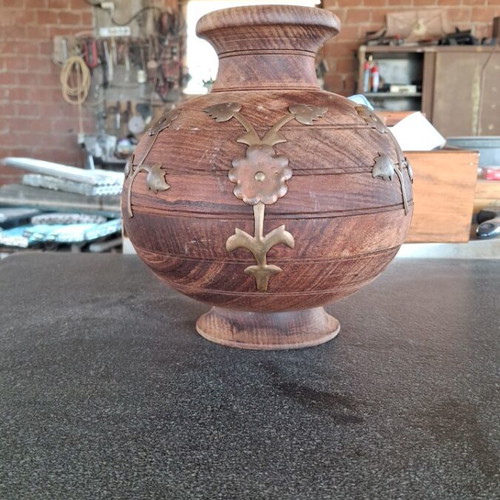 Wooden flowerpot decorated with brass used