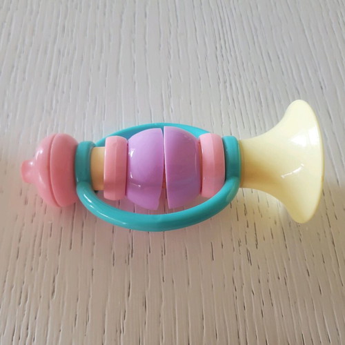 Baby toys ball and horn like new in pastel colors