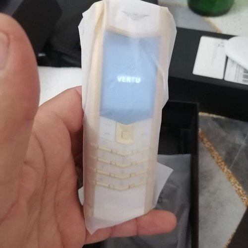 Vertu phone new, gold with metal leather body and dual card slot
