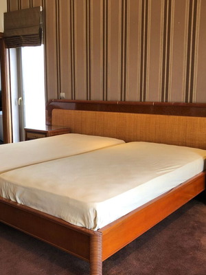 Bedroom set used with two single beds, nightstands and dressing table