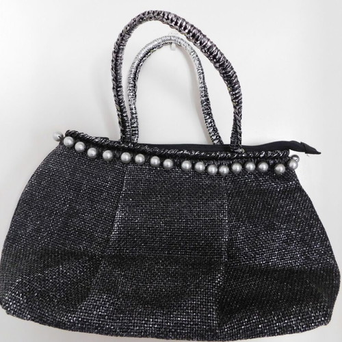 Handheld straw bag metallic like new with feather design and pearl accessory