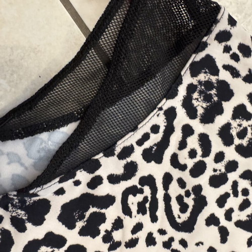 Animal print one-piece swimsuit with black mesh details