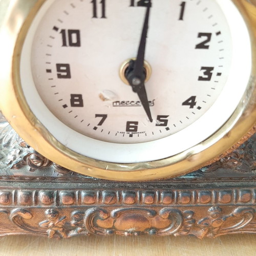Copper German wind-up clock used with cathedral motif