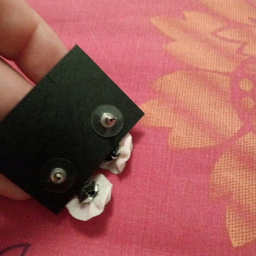 Fwo earrings with white fabric flowers and rhinestones hanging, unworn