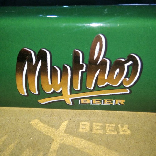 Ceramic Mythos Beer ashtray used with small chip