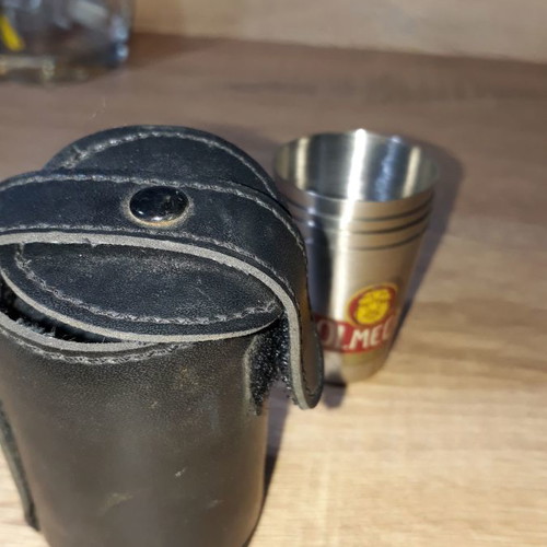 Olmeca leather case and four used shot glasses