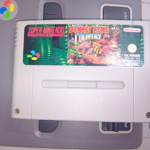 Super Nintendo 1990 console with 2 controllers and 3 games