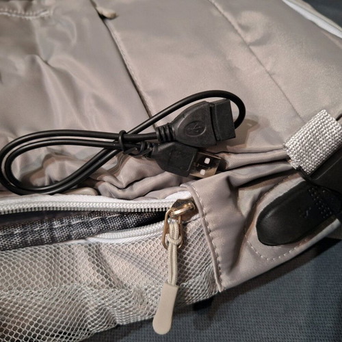Backpack new, gray with multiple compartments and USB port