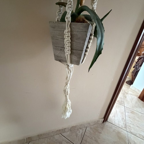 Macrame plant hanger used with wooden beads for pots