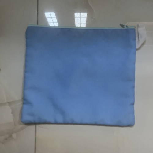 Blue fabric toiletry bag with eye design, 25 x 21 cm