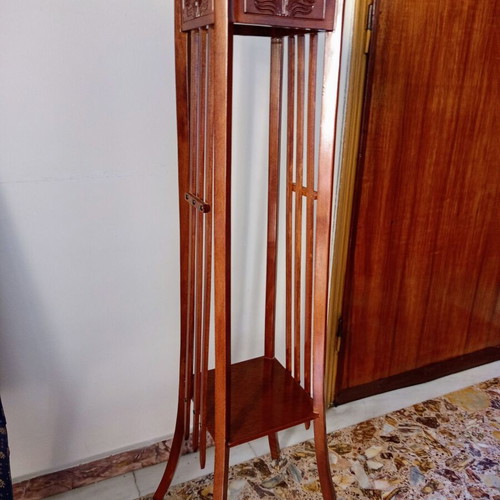 Handcrafted tall wooden plant stand with carved floral details