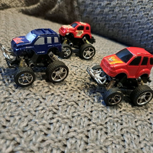 Set of 3 Monster Truck toy trucks like new with oversized wheels and suspensions
