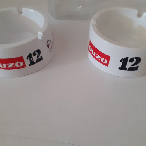 Ouzo 12 ashtrays and small jug like new