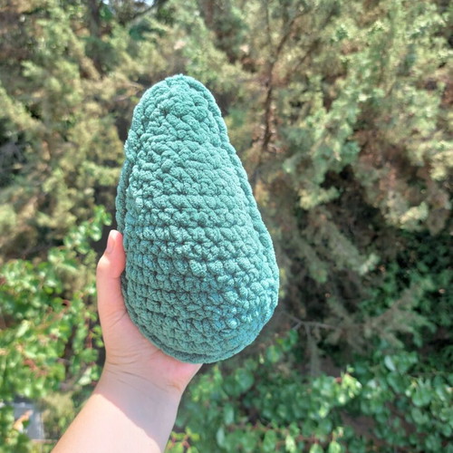 Handmade knitted avocado toy with pit