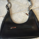 Black shoulder bag with silver chain strap, medium capacity