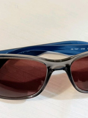 Ray-Ban RB 7047 sunglasses, transparent grey with blue arms