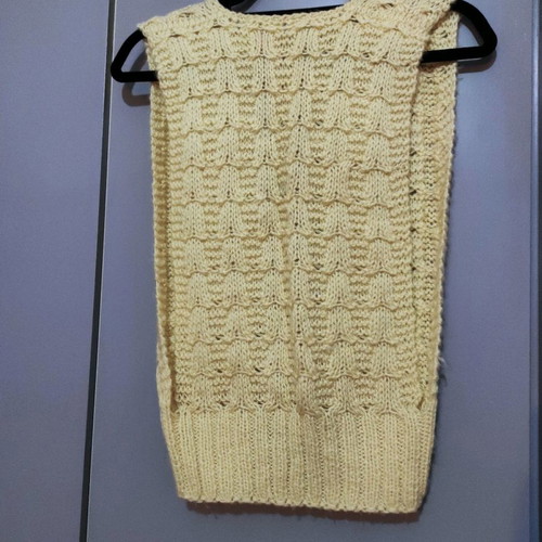 Sleeveless knitted vest used with pattern yellow pale