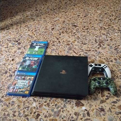 PS4 Pro console with 3 games and 2 controllers