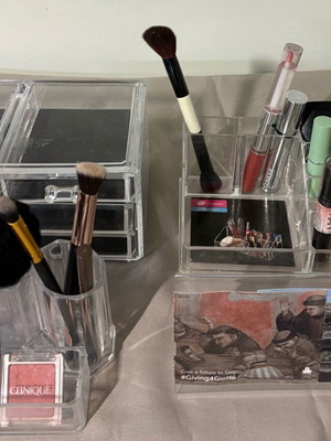 Set of acrylic cosmetic organizers with drawers used