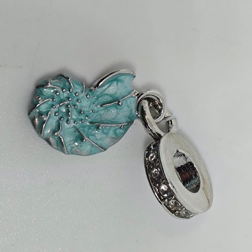 Silver charm with blue enamel Nautilus like new