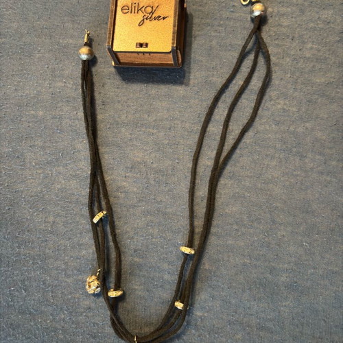 Necklace with cords and gold charms like new stainless steel