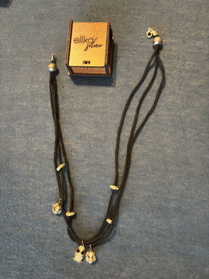 Necklace with cords and gold charms like new stainless steel