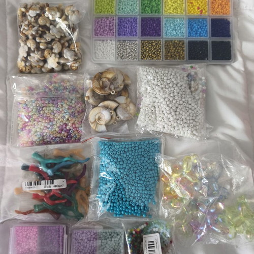 Jewelry making materials like new, shell chips, plastic and resin beads