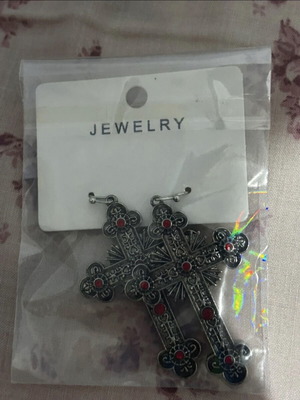 Cross earrings like new with red phosphorescent details