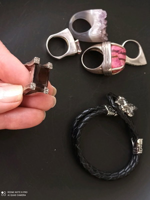 Silver ring with dark brown stone used