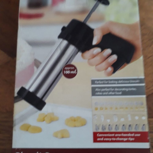 Biscuit press set used with 8 pastry nozzles and 10 dough designs