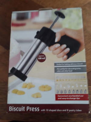 Biscuit press set used with 8 pastry nozzles and 10 dough designs