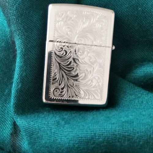 Zippo lighter collectible like new, silver with engravings